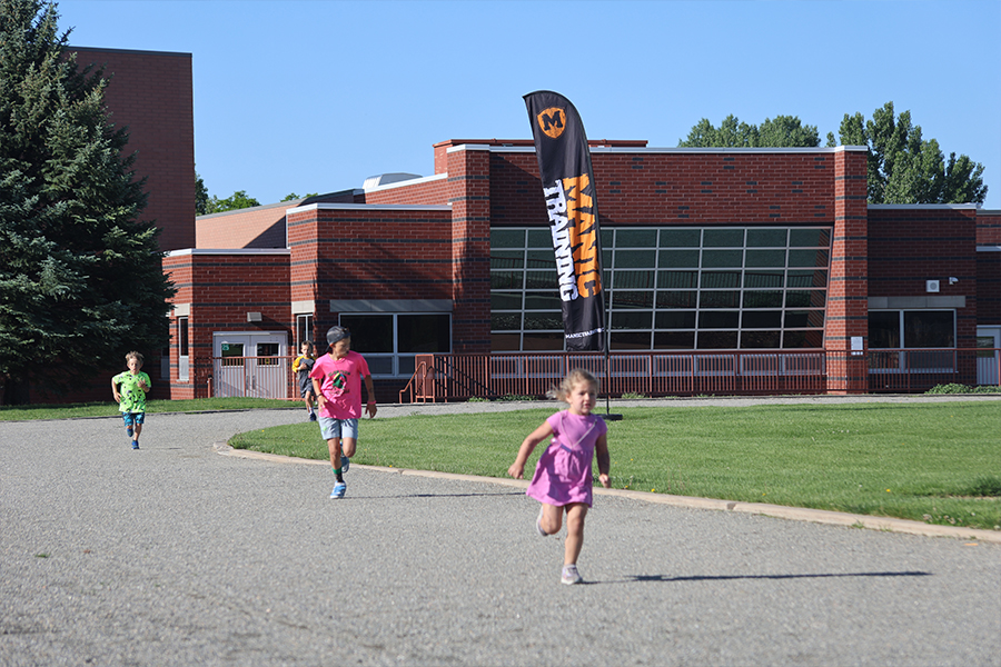 Manic Training kids at our community event running a 1 mile race during the Donut Run