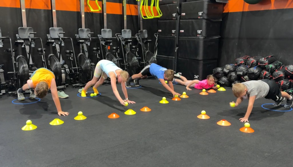 Manic Training kids in a plank